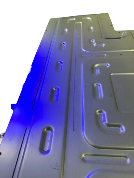 Laser-welded battery cooling plate with coolant channels